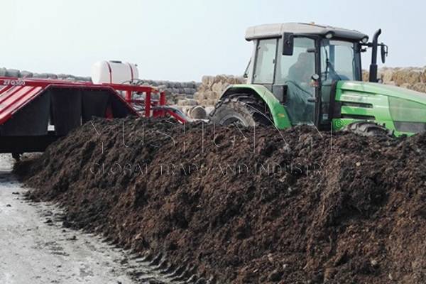 Towable compost turner for composting sludge